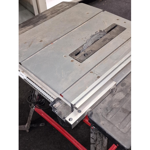 236 - An Einhell electric table saw on stand.