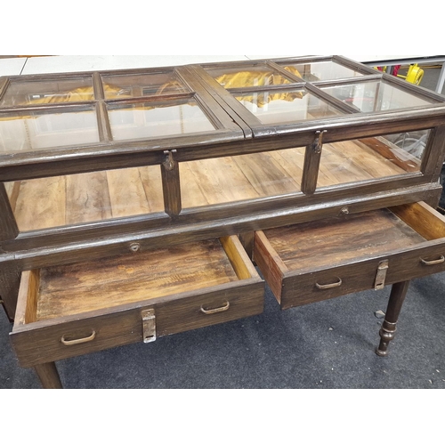 238 - An early 20th century mahogany double sided shopkeepers jewellery display case with glazed top resti... 