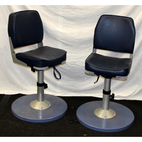 218 - Pair of trawler skipper swivel chairs with fold down backs and adjustable seat height