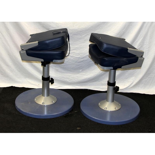 218 - Pair of trawler skipper swivel chairs with fold down backs and adjustable seat height