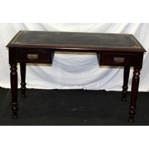 252 - Reproduction two drawer library table with leather top. 130cms across x 79cms tall x 68cms deep