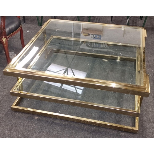 247 - A contemporary gold coloured metal oblong coffee table with glass top and shelf 42x101x101cm.