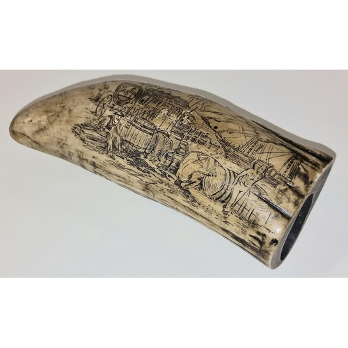 63 - A vintage scrimshaw style resin sperm whale tooth with decorative carvings 14cm in length.