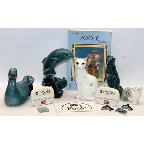 268 - Poole Pottery: A collection of Poole items including blue glaze animals, Poole POS advertising plaqu... 