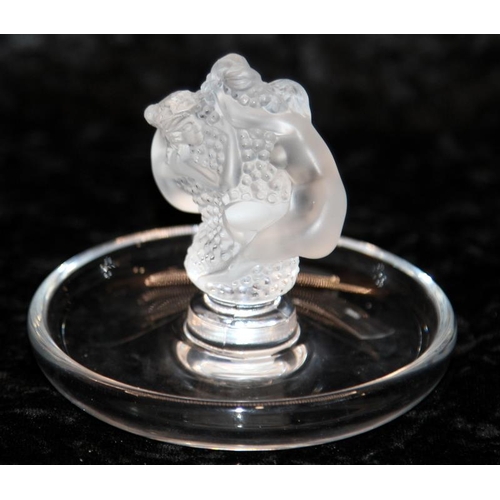 67 - Lalique Roxane pin tray depicting two nude figures around a central column of grapes, frosted figure... 