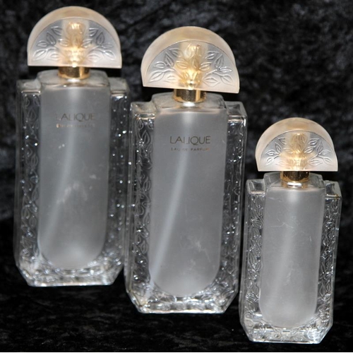 73 - Lalique by Lalique eau de parfum perfume bottles (empty). Two bottles at 16cms tall and a smaller 12... 