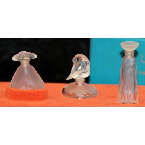 76 - Lalique set of three miniature perfume bottles, 'The Ultimate Collection',  boxed. (bottles are empt... 