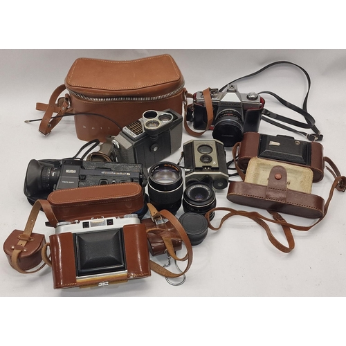 133 - A collection of vintage cameras, super 8 film cine cameras and some lenses. Various makes and models... 