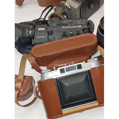 133 - A collection of vintage cameras, super 8 film cine cameras and some lenses. Various makes and models... 