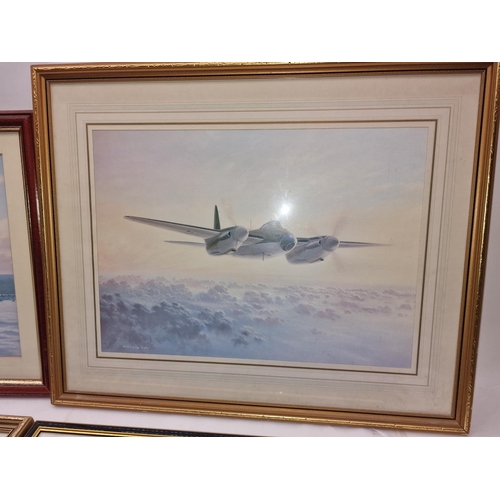 213 - A collection of five framed and glazed aviation prints together with a few related books.