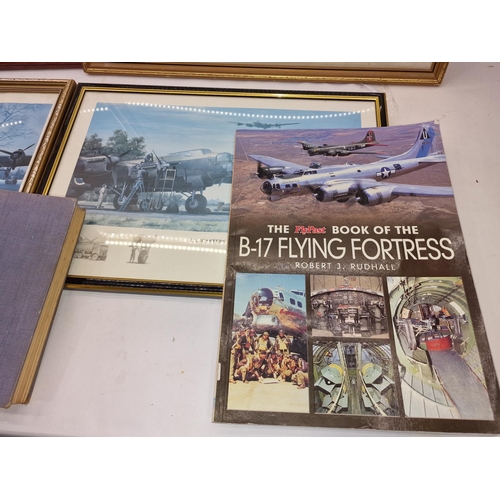 213 - A collection of five framed and glazed aviation prints together with a few related books.