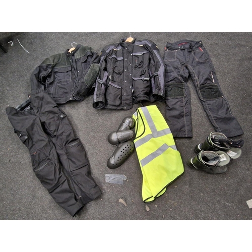 214 - A good quantity of motorcycle gear to include Clover jacket and trousers. Mainly sizes M and L.