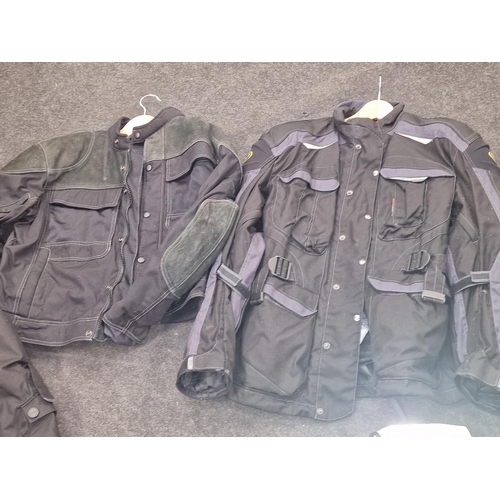 214 - A good quantity of motorcycle gear to include Clover jacket and trousers. Mainly sizes M and L.