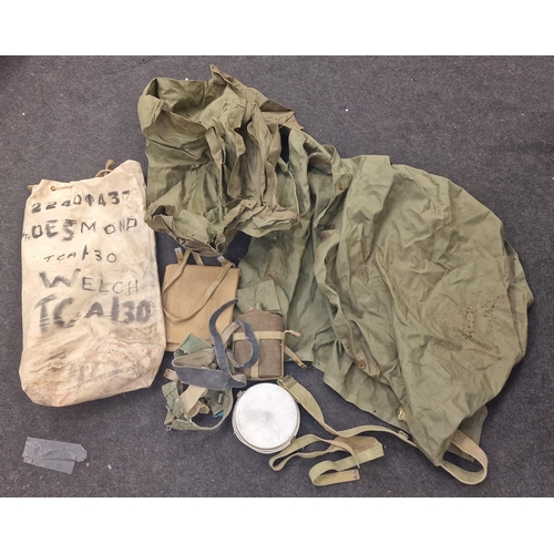 257 - Militaria: British Army Korean War era kit bag c/w raincoat other clothing, water bottle etc. 1956.