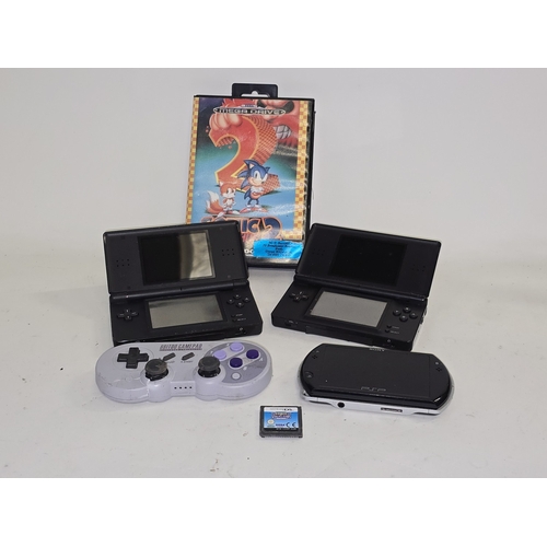 128 - Vintage gaming to include 2 x Nintendo DS Lite consoles, Sega Mega Drive Sonic the Hedgehog 2 cartri... 