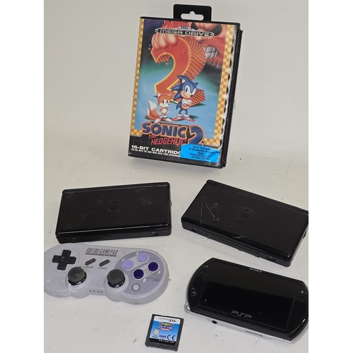 128 - Vintage gaming to include 2 x Nintendo DS Lite consoles, Sega Mega Drive Sonic the Hedgehog 2 cartri... 