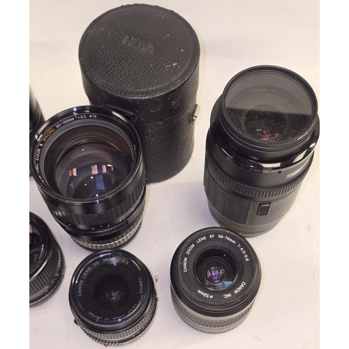 129 - Collection of camera lenses to include Canon. Seven in all.