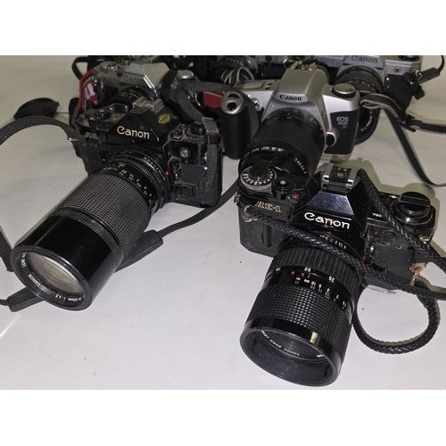 133 - 7 x Canon vintage 35mm SLR film cameras all with lenses attached.
