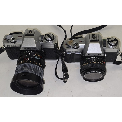 135 - 2 x Minolta X-300 vintage SLR 35mm film cameras both with lenses attached.
