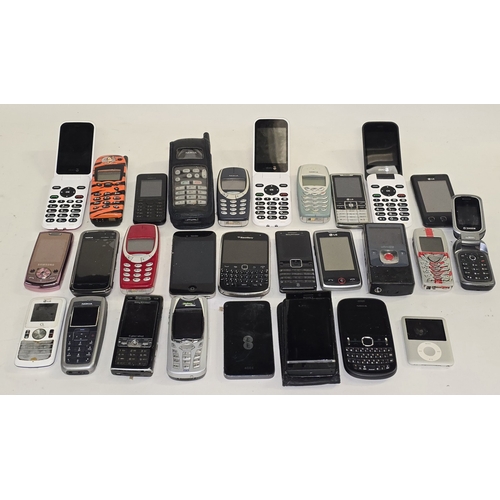 139 - A large collection of mobile phones and other handheld electricals. Various makes and models. 28 in ... 