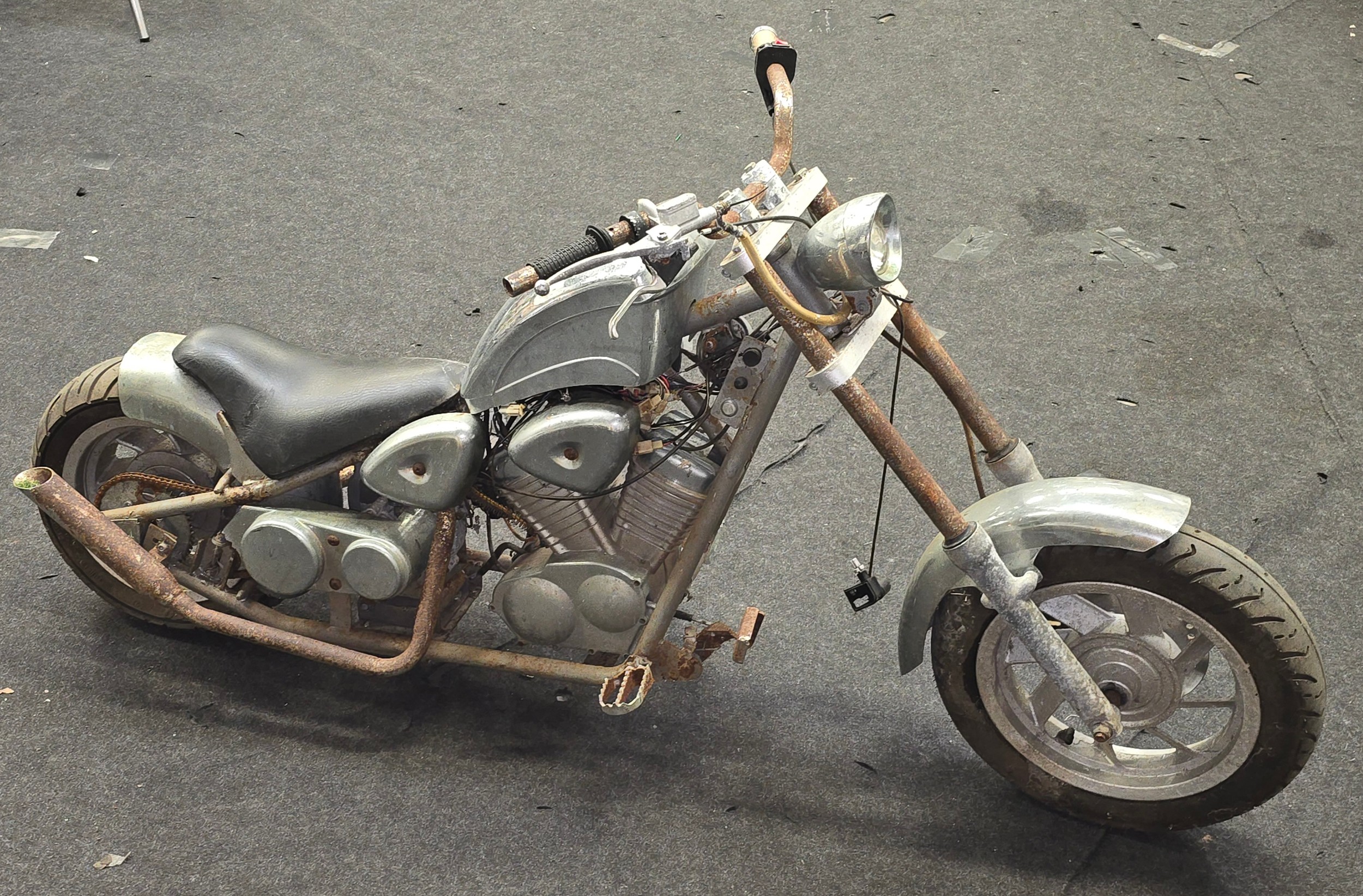 Vintage 50cc petrol mini chopper motorcycle. Offered for parts or repair.