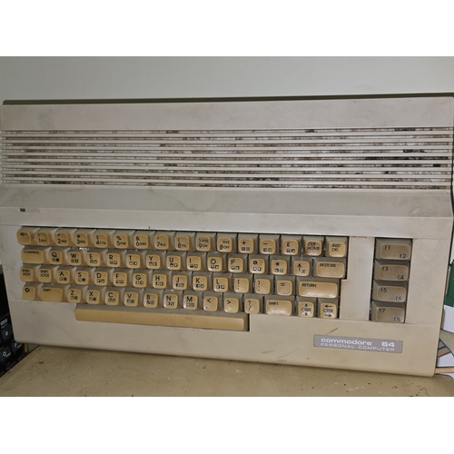 A box of old retro computers consists of BBC Micro, Commodore 64, ZX ...