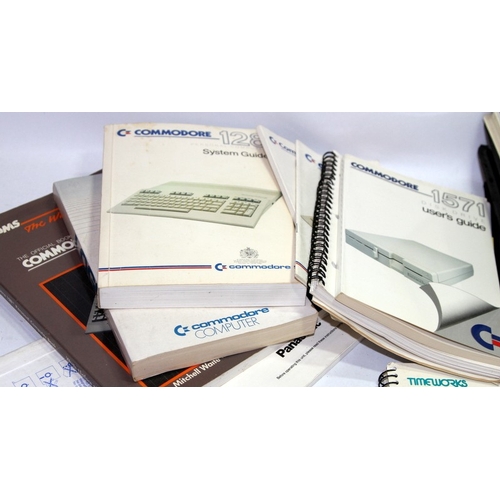 A collection of vintage computing software, diskettes and instruction ...