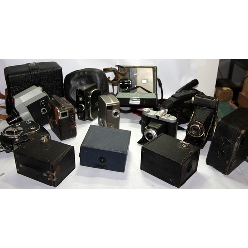 A collection of vintage film movie cameras, box cameras and folding ...