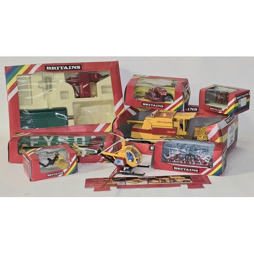 Collection of mostly boxed Britains die cast farm vehicles.