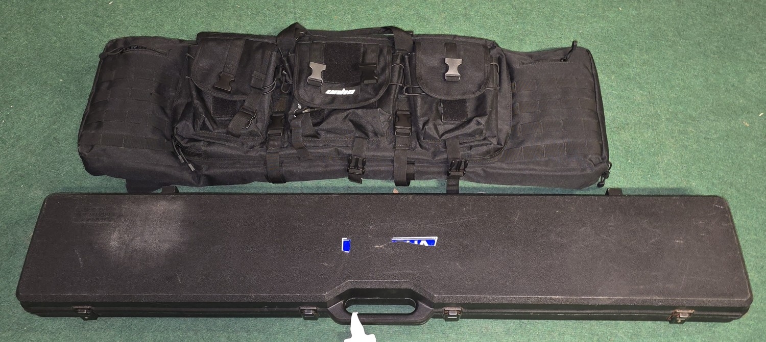 Large multipouch black Hodall fabric gun case together with a hard ...