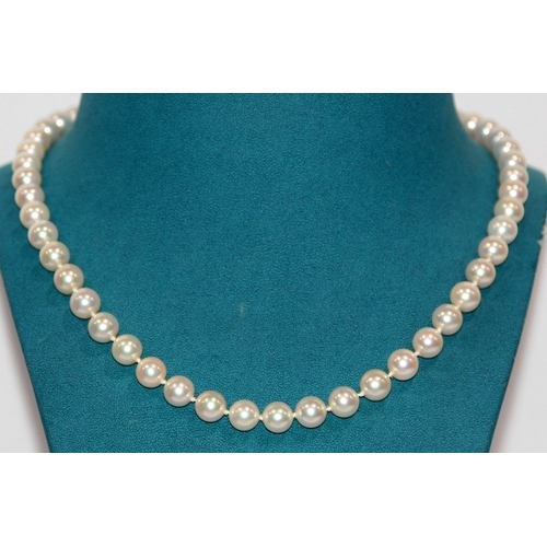 267 - Necklace of cultured pearls, 51 8mm pearls fastened by a 9ct gold clasp. 18