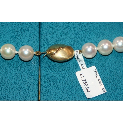 267 - Necklace of cultured pearls, 51 8mm pearls fastened by a 9ct gold clasp. 18