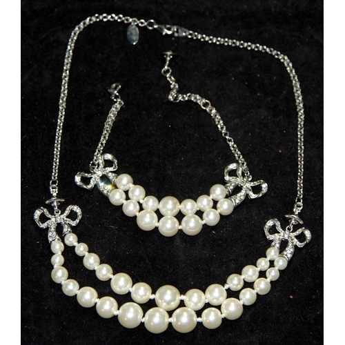 7 - Genuine Vivienne Westwood Jewellery: Faux pearls with bows matching necklace and  bracelet. In excel... 