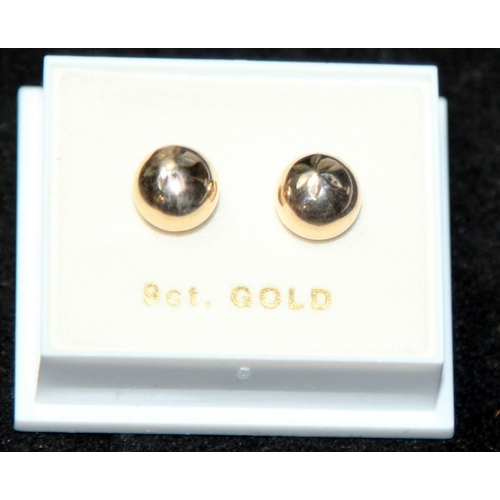 299 - A pair of 9ct gold ball earrings. 0.6g