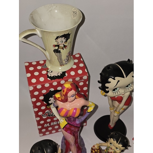 112 - Quantity of mostly Betty Boop related collectables to include figurines, alarm clock, mug sets etc.