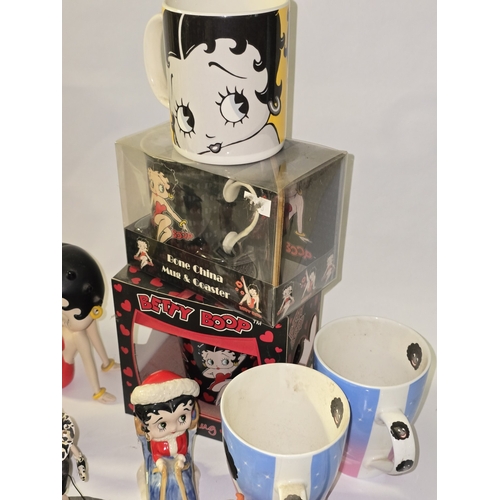 112 - Quantity of mostly Betty Boop related collectables to include figurines, alarm clock, mug sets etc.