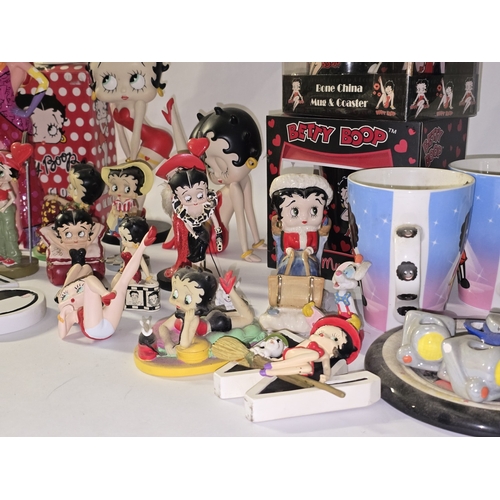 112 - Quantity of mostly Betty Boop related collectables to include figurines, alarm clock, mug sets etc.