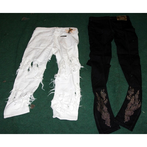 21 - Vivienne Westwood Anglomania Lee Jeans. A pair of white distressed and a pair of black. Both 28