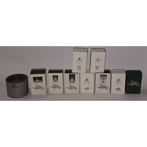121 - A collection of boxed Swarovski crystal to include many 