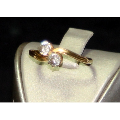 308 - 18ct gold double diamond twist ring size P. Each diamond approx 0.25ct. 3g