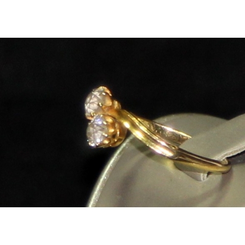 308 - 18ct gold double diamond twist ring size P. Each diamond approx 0.25ct. 3g