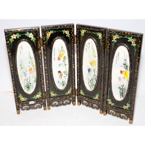 76 - Miniature Oriental wooden hinged screen of four panels each featuring a hand painted porcelain oval.... 