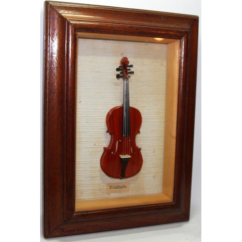 52 - Vintage framed hand crafted miniature Stradivarius.  Cremona violin. Approx 19cms in length, o/all f... 