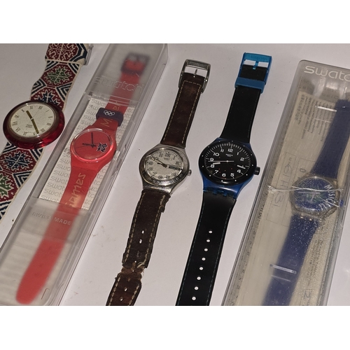200 - A Garmin Forerunner GPS 15 running watch together with a collection of Swatch Watches to include Lon... 