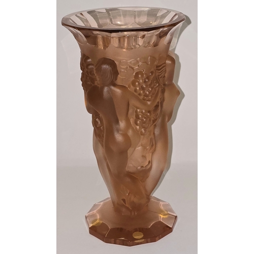 50 - 'R LALIQUE / FRANCE', An amber or peach glass Bacchantes type vase, moulded with three female nudes ... 