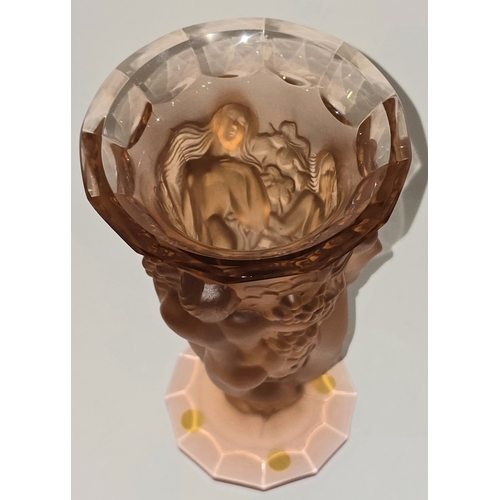 50 - 'R LALIQUE / FRANCE', An amber or peach glass Bacchantes type vase, moulded with three female nudes ... 