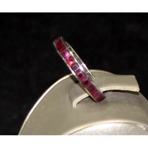 249 - Vintage white metal set ruby eternity ring size O. 3.2g