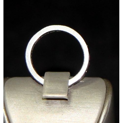 249 - Vintage white metal set ruby eternity ring size O. 3.2g