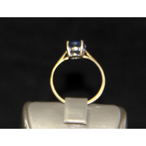 219 - 9ct gold approx 1.2ct Tanzanite solitaire ring size Q. 2g