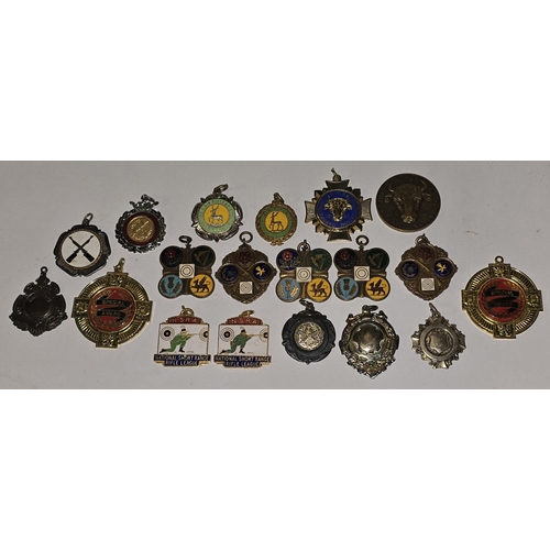 157 - A collection of vintage mostly rifle related medals/fobs to include National Small Bore Rifle Associ... 